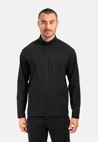 Schwarze Zip-Jacke aus weichem, dehnbarem Stoff. Mit hohem Kragen, langen Ärmeln und Vorderseite mit Reißverschlusstaschen.