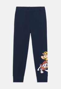 Námorníckomodré detské nohavice s elastickým pásom, s potlačou postáv z Paw Patrol, Maršala a Rubble, pri pravom členku.