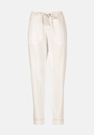 Pantalon décontracté couleur crème avec taille à cordon, poches latérales, jambes effilées et ourlets retroussés.