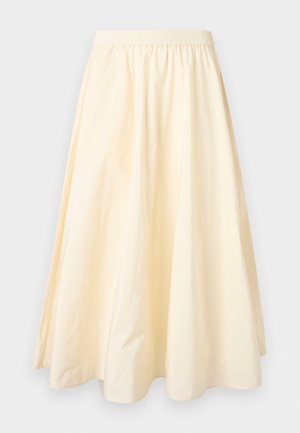 Jupe longue de couleur crème avec une ceinture élastique et une large silhouette évasée en forme de A.