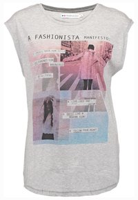 Gray sleeveless T-shirt with a round neckline featuring a collage of images and text in varying colors, conveying a fashion manifesto theme.