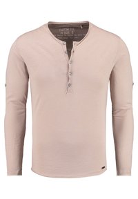 Beige Langarm-Henley-Shirt aus weichem Stoff, mit einer Knopfleiste und dekorativer Naht entlang des Ausschnitts und der Bündchen.