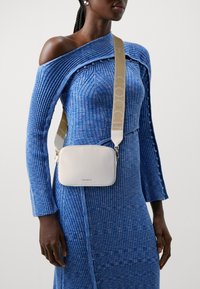 Coccinelle TEBE - Cross body bag - brillant-white
