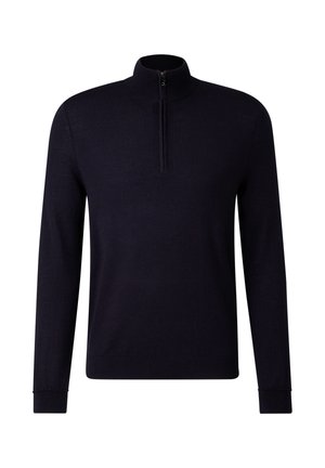 Marineblå trøje med høj krave og halv lynlås. Lange ærmer og ribbede manchetter, lavet af et blødt, tekstureret materiale.