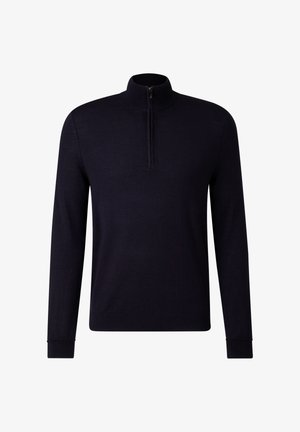 Marineblå trøje med høj krave og halv lynlås. Lange ærmer og ribbede manchetter, lavet af et blødt, tekstureret materiale.