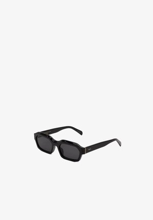 Black rectangular sunglasses with a glossy finish, featuring bold shapes, dark lenses, and gold accent hardware near the temples.