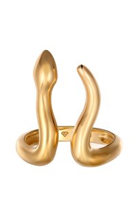 Bague en ton or avec un design ondulé et fluide. Présente une surface lisse et polie, ainsi que deux extrémités courbées vers le haut, créant une silhouette unique.