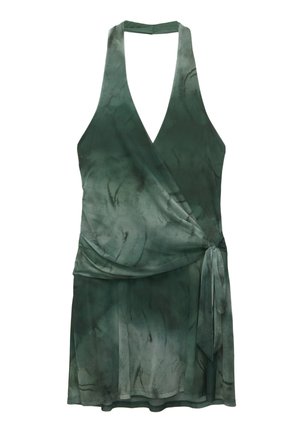 Wrap dress made of lightweight fabric in deep green, featuring a v-neck, halter design, tie detail at the waist, and a flowing silhouette.