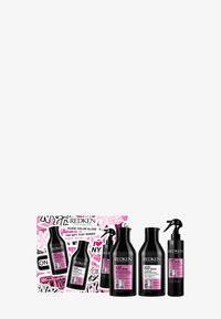 Il set regalo Redken Acidic Color Gloss include quattro bottiglie nere con etichette rosa, presentato in una vivace scatola grafica.
