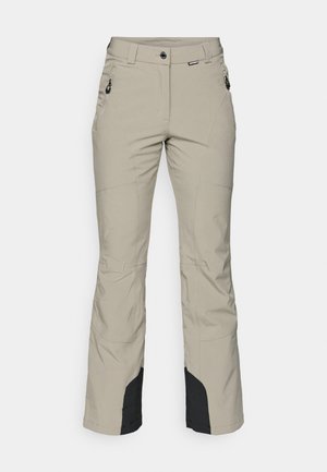 Beige ulkoiluhousut suoran lahkeen designilla, mustilla yksityiskohdilla lahkeissa ja kahdella vetoketjullisella etutaskulla. Valmistettu kestävästä kankaasta.