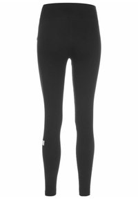 Sorte leggings laget av elastisk stoff, med høy midje og en jevn tekstur, med et lite merke på siden.