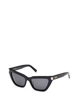 Black cat-eye sunglasses with a matte finish, grey tinted lenses, and gold hardware accents. The brand "MCM" is displayed on the temple.