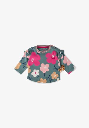 Langärmliges Shirt aus türkisem Baumwollstoff mit floralen Mustern in Pink, Pfirsich und Weiß. Verfügt über Rüschensleeves und einen kleinen Tag-Akzent.