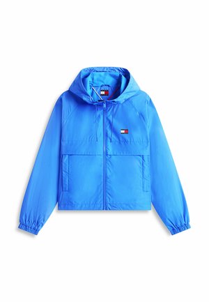 Felblauwe gewatteerde jas met capuchon, ritssluiting aan de voorkant, elastische manchetten, twee zakken aan de voorkant en een klein rechthoekig logo op de borst.