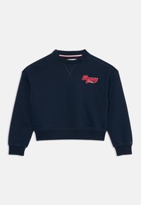 Marineblå avkortet sweatshirt laget av bomullsblanding med rund hals, ribbestrikkede mansjetter og brodert "Tommy"-logo i rødt.
