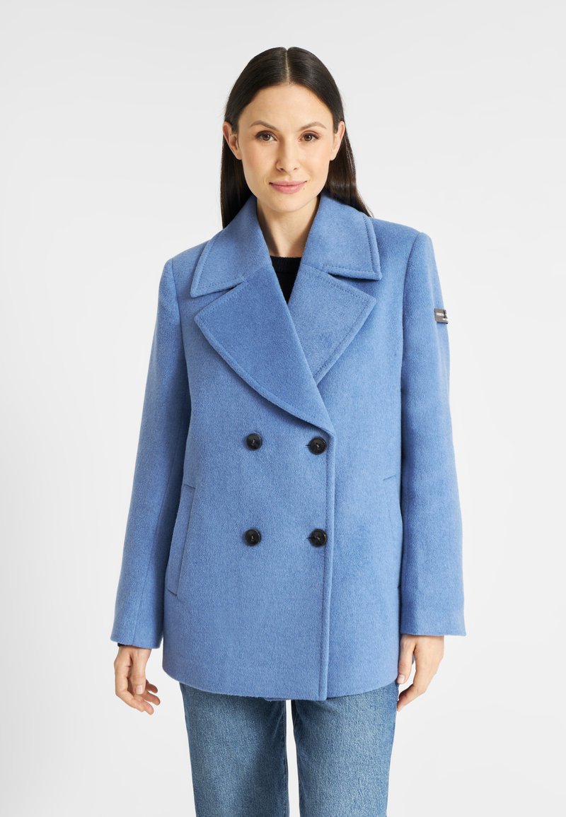 Dubbelzijdige blauwe wollen jas met brede revers, zwarte knopen en zijzakken, met een zachte textuur en een klassieke snit.