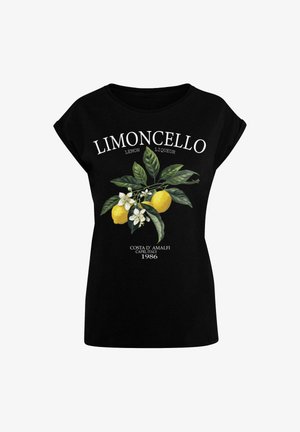 Tricou negru cu un design grafic de lămâi și flori, cu textul „Limoncello” deasupra și „Costa d’Amalfi, Capri, 1986” dedesubt.