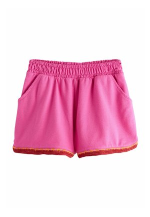 Bright pink elastic waist shorts with side pockets and a multicolored orange-red trim along the hem.
