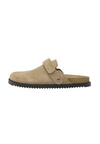 Beige velúr klump, kerek orral, állítható pánttal és textúrált fekete gumitalppal. Minimalista dizájnnal és biztonságos illeszkedéssel rendelkezik.