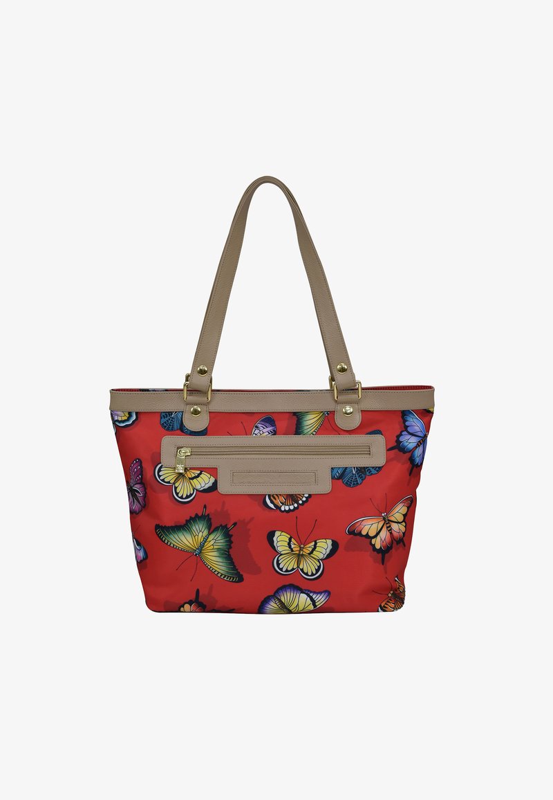 Rode tote bag met vlinderprint, beige nepleer handvatten en accenten, ritszakdetail en een gestructureerde vorm.