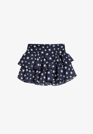 Marineblå rynket nederdel med hvide stjernesymboletter, lavet af blødt stof med en bred talje og lagdelt design.