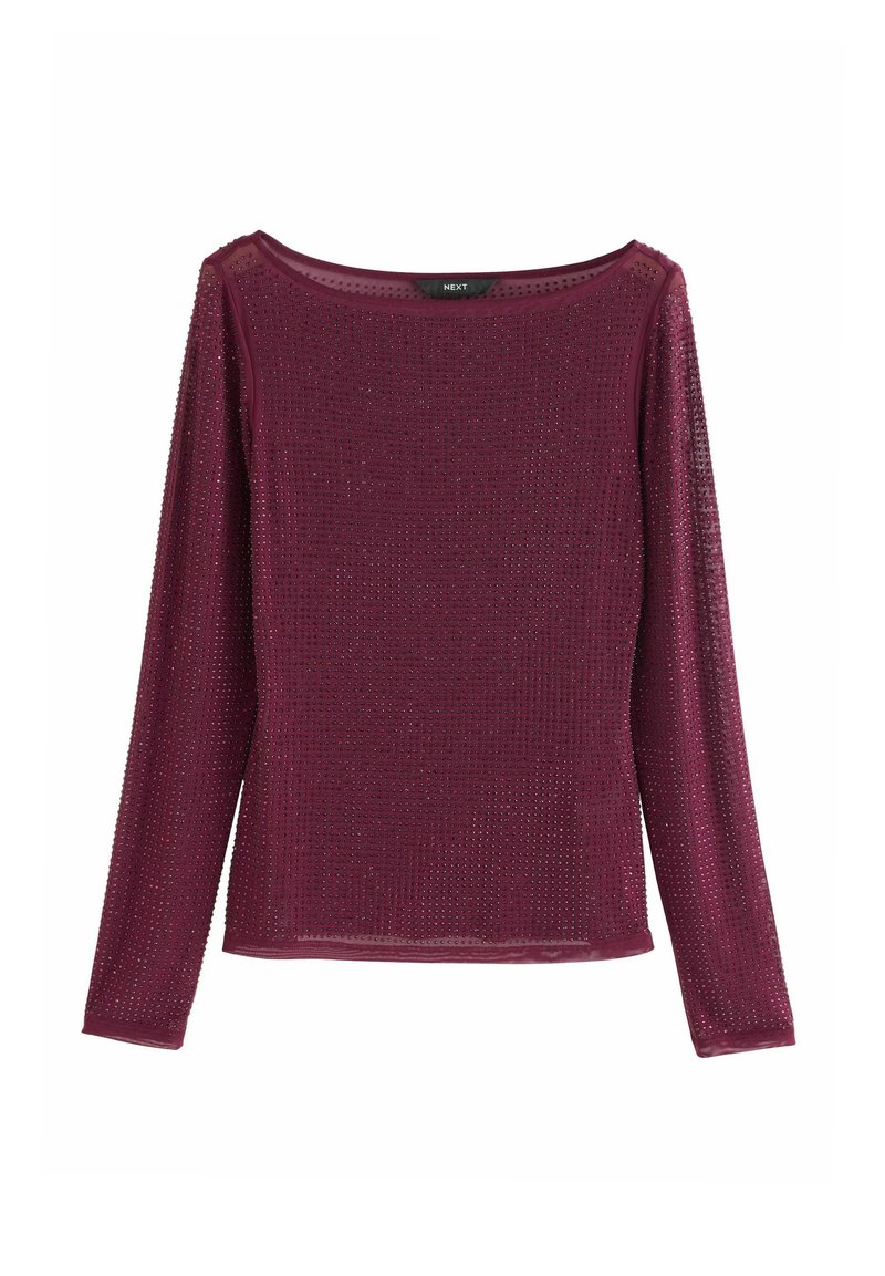 Dugih rukava tamnoljubičasti top od teksturirane tkanine s malim perforacijama. Okrugli izrez s prozirnim detaljima uz ovratnik i rukave.