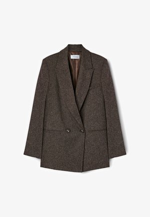 Brązowa marynarka w tweed z podwójnym zapięciem, klapami notch i dwiema przednimi kieszeniami. Podszewka o gładkiej teksturze.