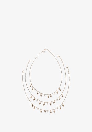 Zlatý vrstvený náhrdelník s designem řetízku z korálků. Obsahuje kouzelné šarmové listy a fasetované křišťálové akcenty. Nastavitelná délka pro přizpůsobení.