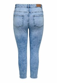 Gaiši zili šauri džinsi ar izgaismotu mazgāšanu, piecām kabatām un neapstrādātu apakšmalu. Izgatavoti no džinsa ar gludu tekstūru un nedaudz elastīgu piegulšanu.