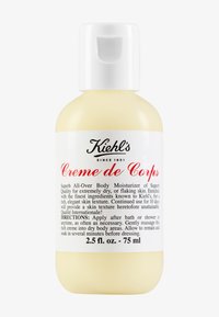 Kiehl's Creme de Corps, 74 ml, gul plastflaska med vit pump-top, svart och röd text som beskriver produktens användning och ingredienser.