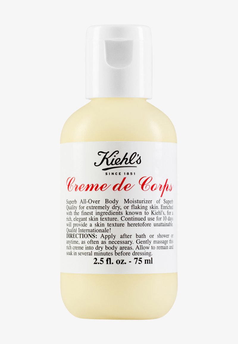 Kiehl's Creme de Corps, 74 ml, gul plastflaska med vit pump-top, svart och röd text som beskriver produktens användning och ingredienser.