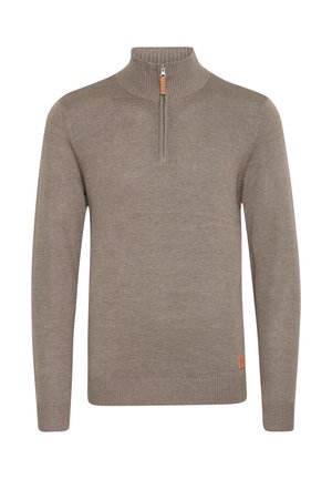 Light brown knitted pullover with a high collar, half-zip closure, and ribbed cuffs and hem. Features a small leather accent on the side.
