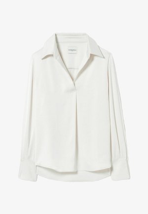 Blouse blanche à manches longues avec col ouvert, boutons cachés à l'avant et larges poignets en tissu lisse.