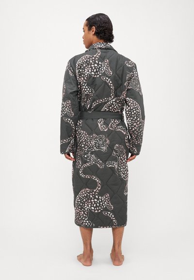 Quilted robe in dark grey with a leopard pattern in light pink. Features a belted waist and long sleeves, extending to calf length.