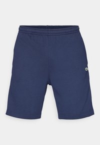 Navy blue casual shorts with elastic waistband and small embroidered logo on right thigh, displayed on plain background.