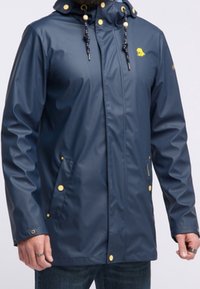 Water-resistant navy rain jacket with a hood, gold hardware accents, front pockets, and a small yellow emblem on the chest.