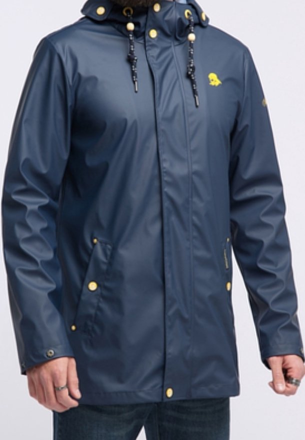Water-resistant navy rain jacket with a hood, gold hardware accents, front pockets, and a small yellow emblem on the chest.
