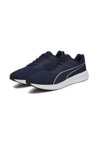 Zapatillas deportivas de color azul marino con parte superior de malla, acentos blancos y suela texturizada. Cuentan con cordones y un talón acolchado para mayor comodidad.