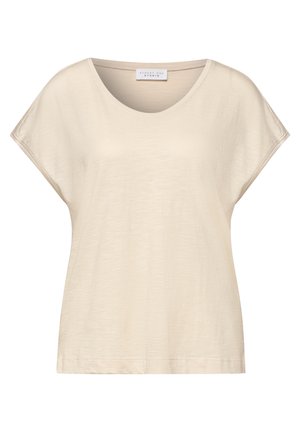 Top beige de mujer con manga corta, cuello redondo, corte holgado y etiqueta "Street One Studio" dentro del cuello.