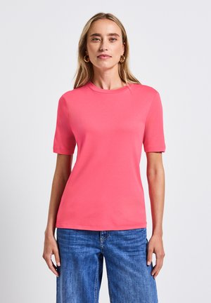 Kortärmad, rundhalsad t-shirt i ljus korall, tillverkad av mjuk bomull, med en åtsittande design och subtila sömdetaljer.