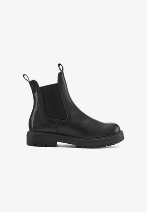 Black leather Chelsea boot with elastic side panels, pull tabs, and a chunky rubber sole featuring a patterned tread. Smooth texture overall.