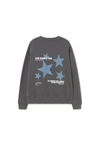 Dark gray sweatshirt with blue stars and white text reading "Stay Always True" and "In a world that's always trying to shape you."