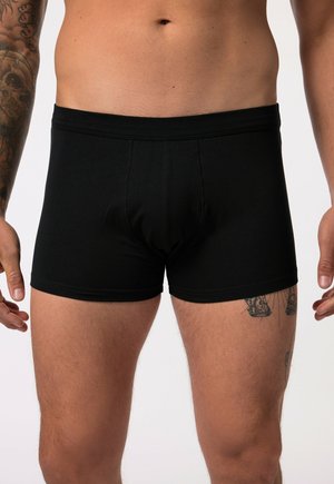 Boxer shorts en coton noir au design ajusté, rehaussés d'une taille douce et d'une texture lisse ; adaptés à un usage quotidien.