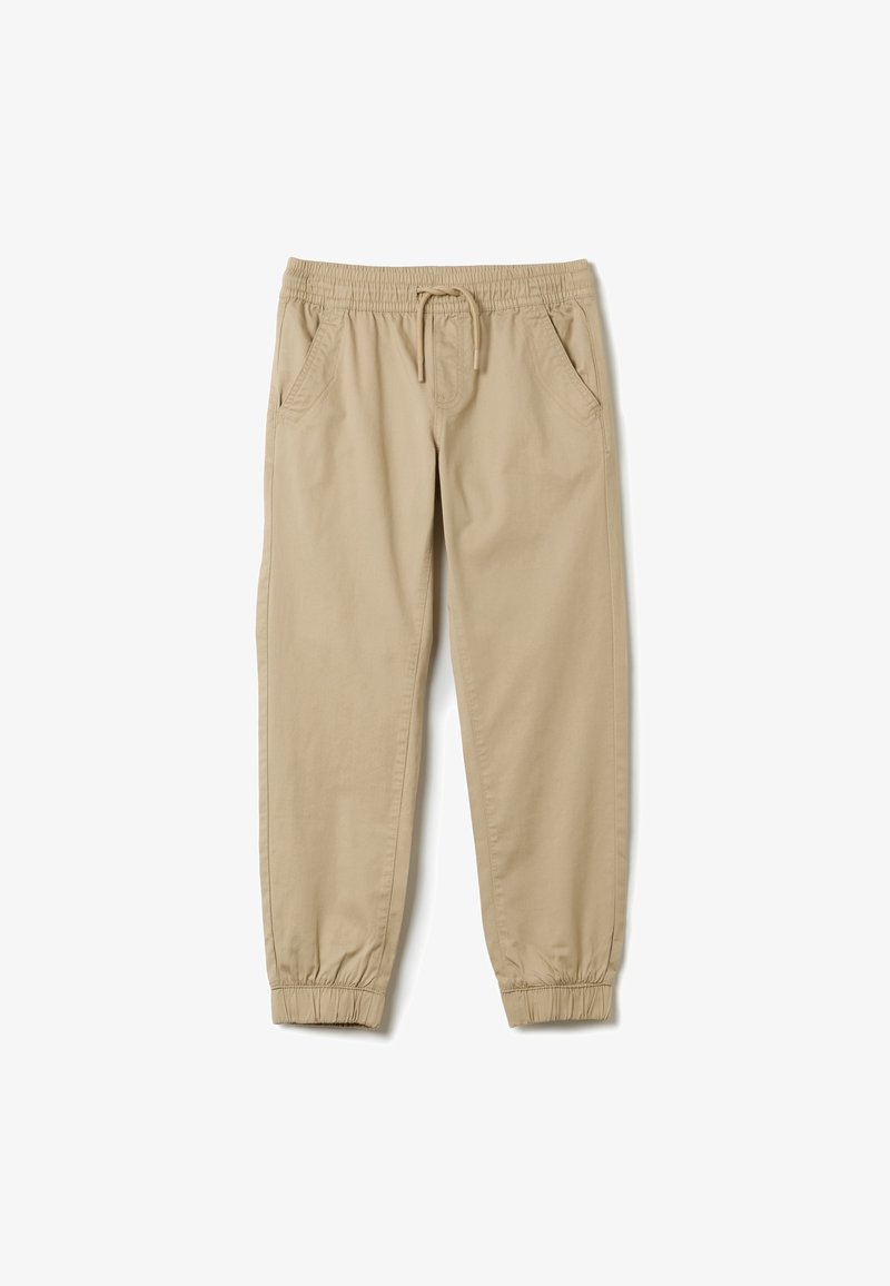 Beige Jogginghosen aus weicher Baumwolle, mit einem elastischen Taillenbund und Kordelzug, Seitentaschen und elastischen Bündchen an den Knöcheln.
