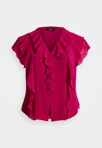 Fuchsia blus med V-ringning och volang framtill. Korta ärmar med volanger, lätt tyg och knappproppar framtill.