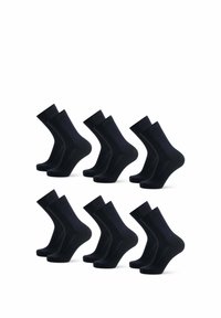 Svarta bomullssockor arrangerade i två rader. Varje socka har en slät yta och standard knähöjd med ribbat topp.