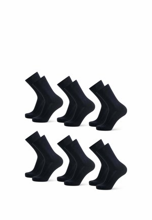 Chaussettes en coton noires disposées en deux rangées. Chaque chaussette présente une texture lisse et une longueur standard de type mi-mollet avec un haut côtelé.