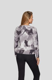 Gray pullover featuring abstract patterns with rounded shapes, long sleeves, and a soft texture. The back view highlights its relaxed fit.