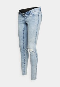 Jeans ajustados de denim en azul claro, con un detalle rasgado en la rodilla y un sutil desvanecimiento, con cierre de botón y lazos para cinturón.
