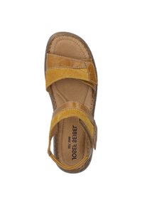 Brown leather sandal with cross-over straps, featuring a soft suede accent, cushioned insole, and reinforced stitching along the edges.